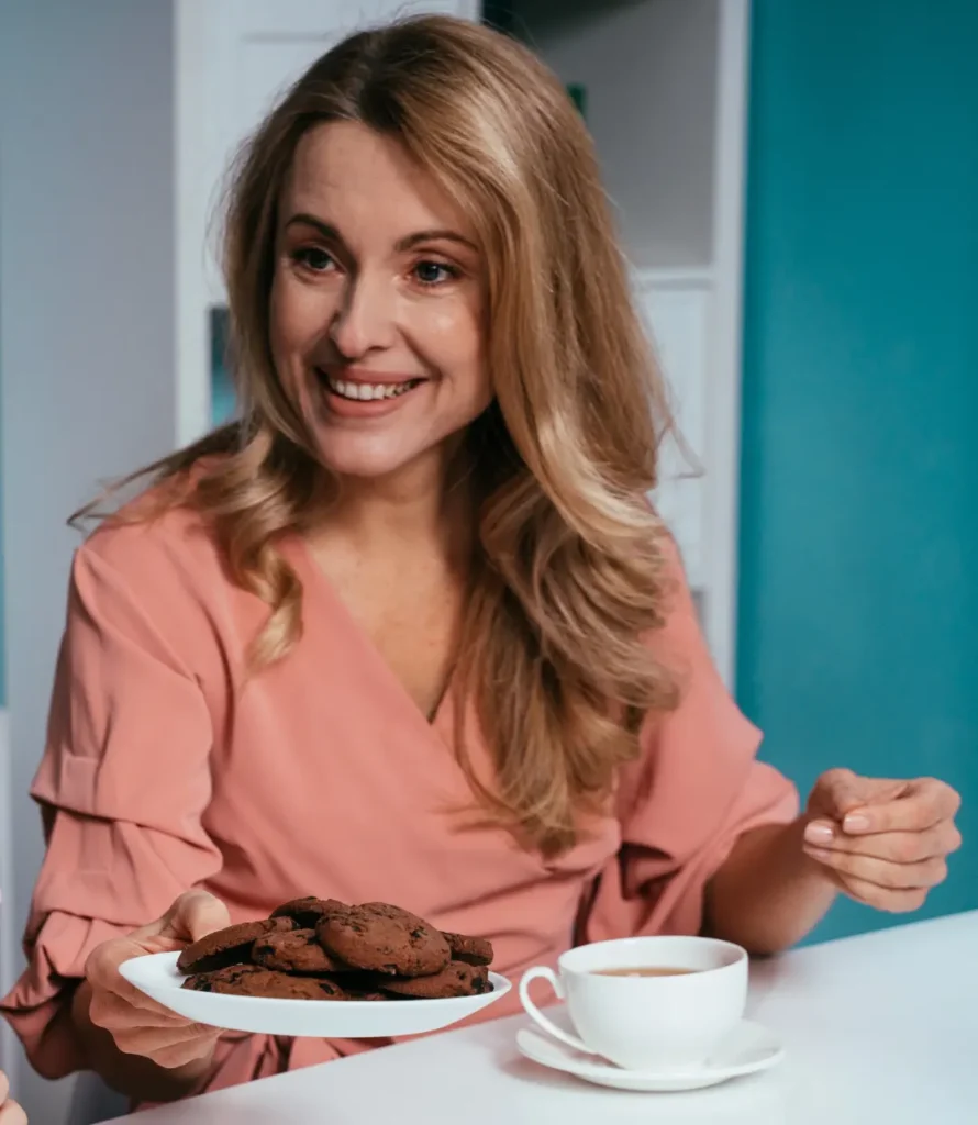 Emma sharing family recipes with a warm smile